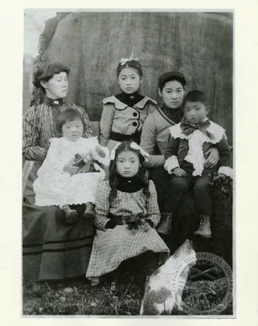 Miyo Iwakoshi, left, with her grandchildren and daughter, Jewel Nitobe