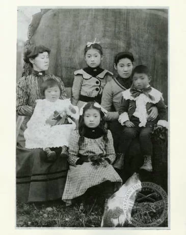 Miyo Iwakoshi, left, with her grandchildren and daughter, Jewel Nitobe